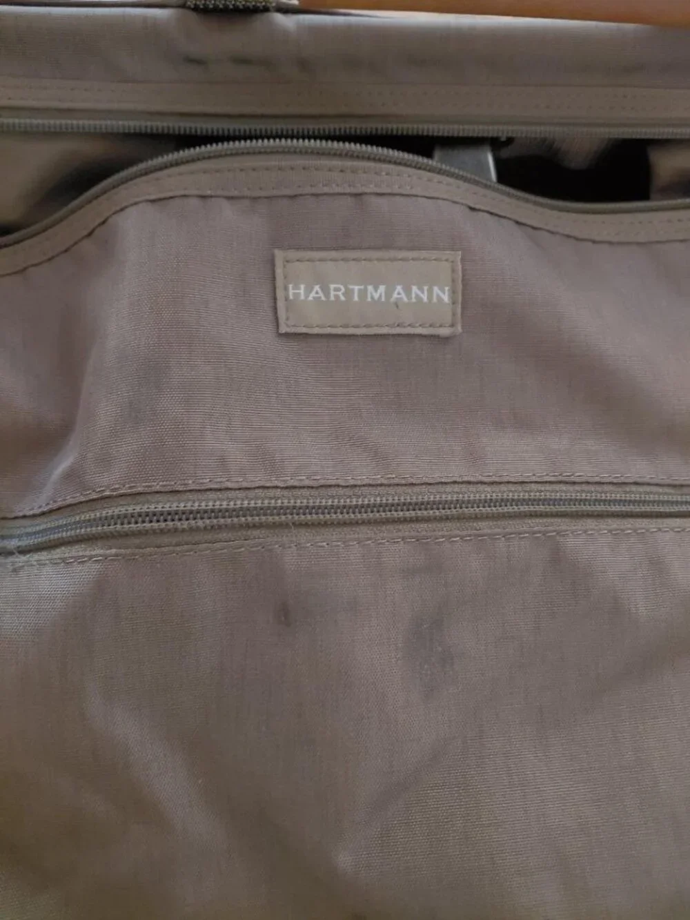 Features 2 deep front pockets with exterior/ interior zipper compartments galore